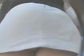 Public spy cam video of a woman's ass cheeks peeking out of her short skirt
