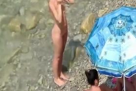 Nude women in rocky beach