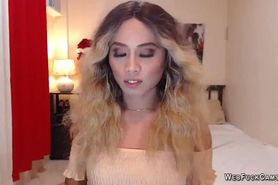 Shemale masturbates and cums in hand in front of webcam