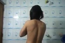 girl changing in her washroom nude..........