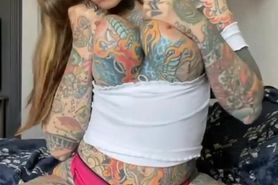 Tattooed bitch spreads her pussy for you