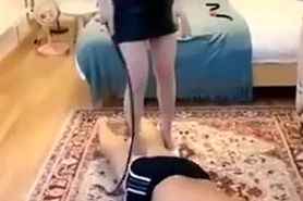 Chinese mistress punishing handcuffed slave