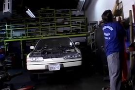 Two service technicians drill hot brunette in the garage