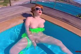 Horny redhead MILF fucks herself in the pool, until dick arrives!