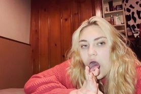 A blonde licks her toes to make you cum