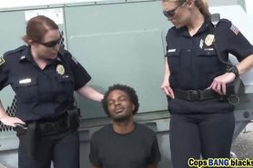 Two nasty female cops get their wet hungry pussies banged by horny black felon