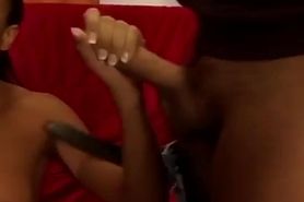 Ebony hottie takes two long white cocks on couch