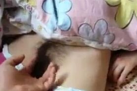 Sleeping Asian gets hairy pussy fingered