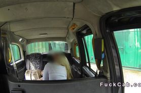 Blonde bangs in cab while laying on the side