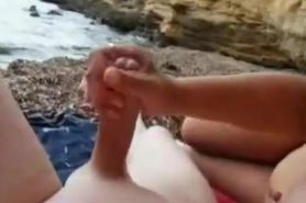 Couple relaxes and lucky guy gets good handjob