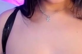 Busty Latina plays alone