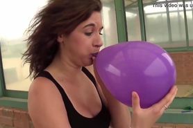 Fifi Foxx Blows and Pops Balloons Outdoors