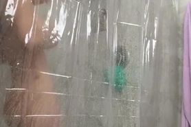 Beautiful women filiming herself while showering and bathing