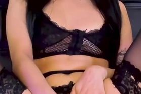 Latina in black lingerie fingering her pussy