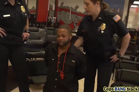 2 female officers apprehend a black suspect to screw