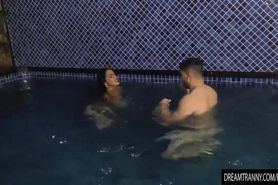 Voluptuous Shemale Sabrina Sousa and a Guy Make Out in a Swimming Pool