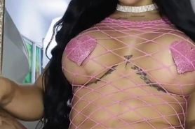 Latina in pink fishnet lingerie