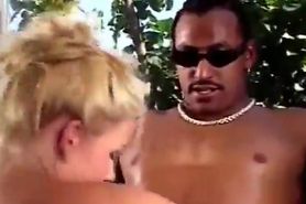 Sexy blonde gives black guy a great blowjob