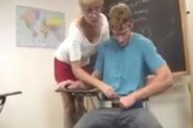 Hot blonde teacher is stroking a big cock