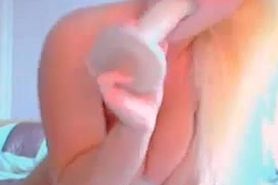 Blond model teasing her pink pussy in webcam chat