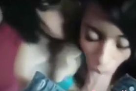 Two hot girls blow a big dick