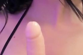 Adorable brunette with braces spits on her tits and on a dildo, she's waiting for your cum