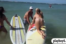 Naked badass babes enjoyed water surfing with the real pro