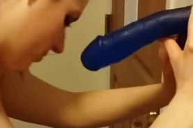 Blowing a dildo