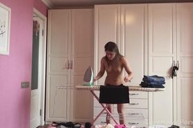 Ironing girl all naked in her house
