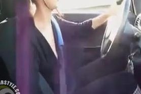 Female driver gives a car handjob and licks up the cum