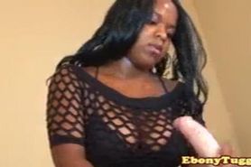 Fishnet ebony girl tugging with two hands