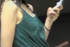 Black-haired hot babe messing with her phone during wild top sharking