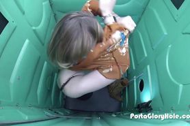 Pale girl sucking dick in parking lot inside of the porta gloryhole at night time