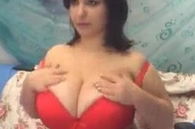 Milf in red lingerie shows her huge tits