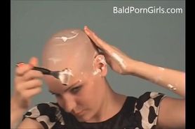 Bald busty girl gives head