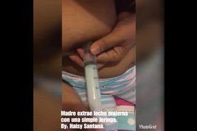 Sexy fat latina women pumping milk at syringe (lactation)