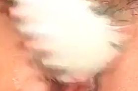Asian girl pleasured with a vibrator