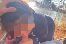 Asian sucking cock by the lake