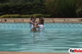 Josy breaks Nickis pussy with her entire fist in the pool