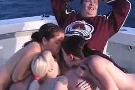 Three girls suck a fat mans cock on a boat