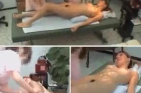Spy cam shows a naked Japanese girl receiving a massage
