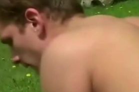 Nasty slut ramming a stud's ass by the poolside with a strapon