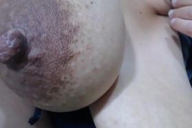 Giving you mouth watering with her big lactating boobs with areolas and dark nipples