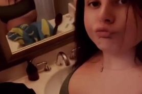 Hannah showing off her green bikini in the bathroom (Loop)