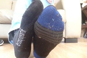 Taking off black dirty socks, sock fuzz and dirty feet
