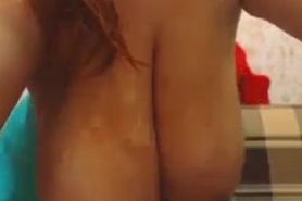 Webcam milf teasing her huge tits