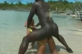 A blonde slut satisfies a black and a latino man at the beach