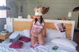 Latina masturbates with a vibrator on a bed