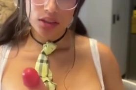 Latina in a costume masturbates with a vibrator