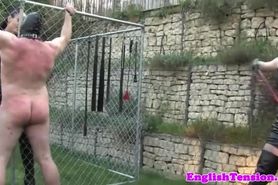 Femdom harshly punish sub with whips outdoor
